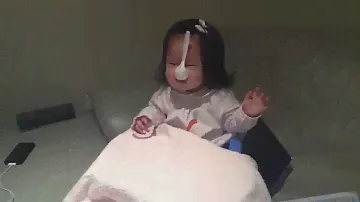 Happy baby with spoon.