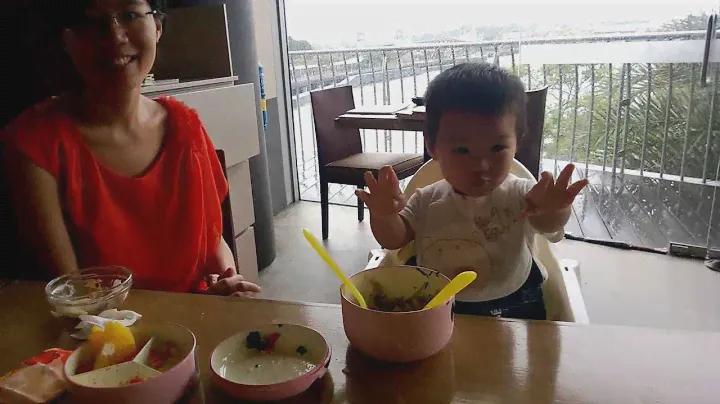 Happy Baby KY using fork and spoon in a Restaurant